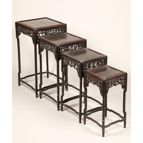 616 - Nest of four Chinese hardwood tables, rectangular painted tops with raised moulded edges above a fri... 