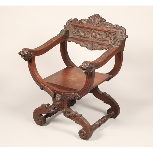 618 - Early twentieth century carved oak X framed chair with carved animal face masks, length 60cm, depth ... 