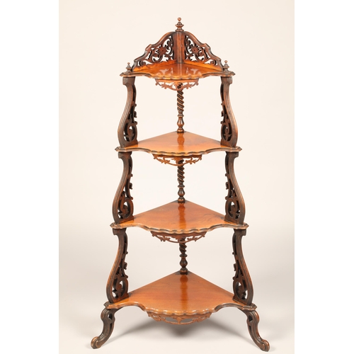 619 - Walnut four tier what-not with carved supports and aprons, height 124cm