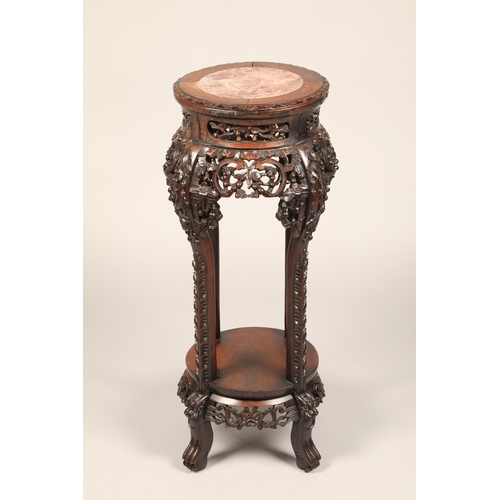 624 - Chinese carved Jardiniere stand with rouge marble insert with carved apron with under tier, height 8... 