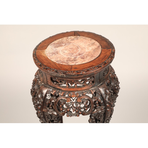 624 - Chinese carved Jardiniere stand with rouge marble insert with carved apron with under tier, height 8... 