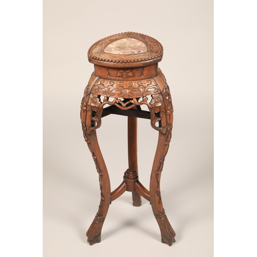 625 - Carved Chinese Jardiniere stand with rouge marble insert with carved apron mounted on three legs, he... 