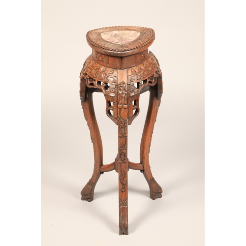 625 - Carved Chinese Jardiniere stand with rouge marble insert with carved apron mounted on three legs, he... 