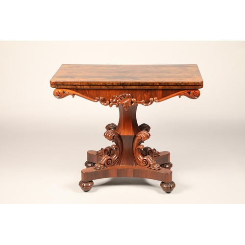 628 - Victorian rosewood fold over games table on central column with four supports on quadraform base