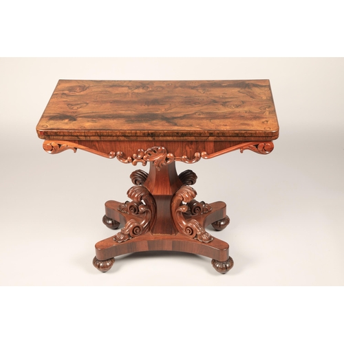 628 - Victorian rosewood fold over games table on central column with four supports on quadraform base