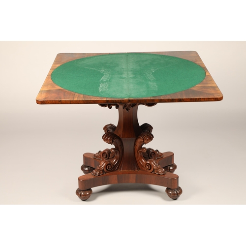 628 - Victorian rosewood fold over games table on central column with four supports on quadraform base