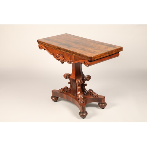 628 - Victorian rosewood fold over games table on central column with four supports on quadraform base