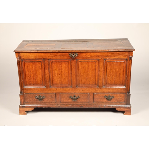 633 - Georgian oak coffer, hinged top over a four panelled front above three fitted base drawers, length 1... 