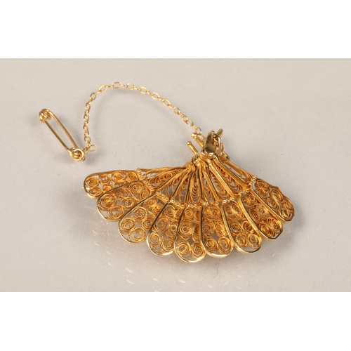 83 - Ladies unmarked yellow metal brooch in the form of a fan, 5cm diameter, weight 9.6g