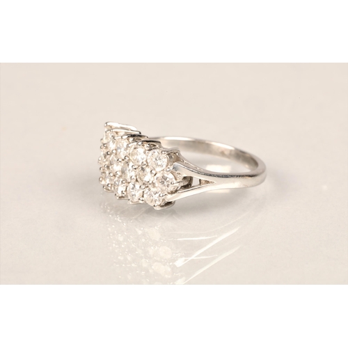 87 - Ladies 18ct white gold diamond cluster ring, set with three rows of small diamonds on an 18ct white ... 