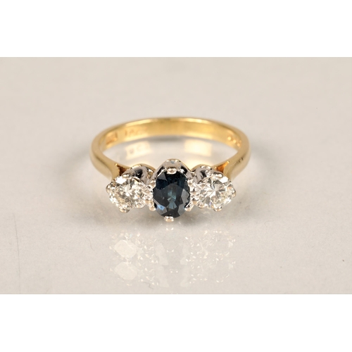 93 - Ladies diamond and sapphire ring, central sapphire with a 0.25 carat diamond on either side set on a... 