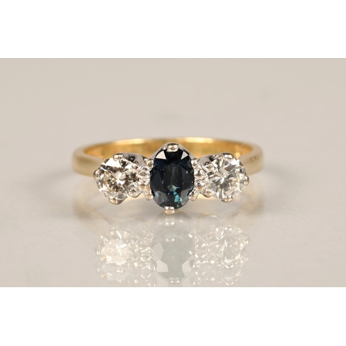 93 - Ladies diamond and sapphire ring, central sapphire with a 0.25 carat diamond on either side set on a... 