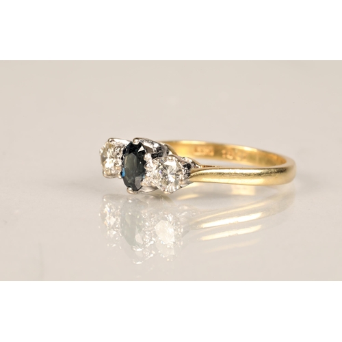 93 - Ladies diamond and sapphire ring, central sapphire with a 0.25 carat diamond on either side set on a... 