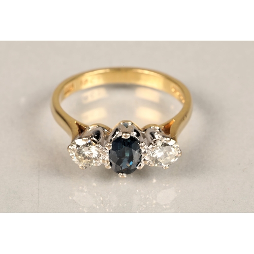 93 - Ladies diamond and sapphire ring, central sapphire with a 0.25 carat diamond on either side set on a... 