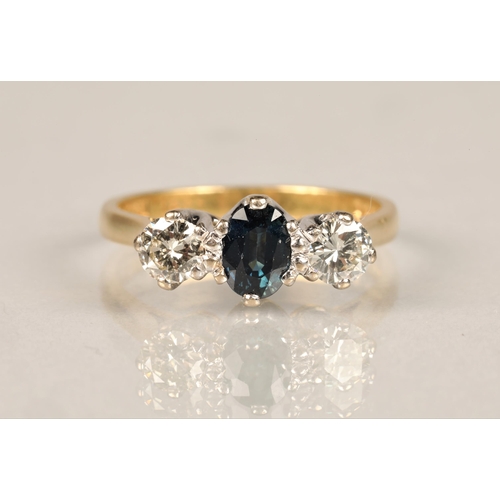 93 - Ladies diamond and sapphire ring, central sapphire with a 0.25 carat diamond on either side set on a... 