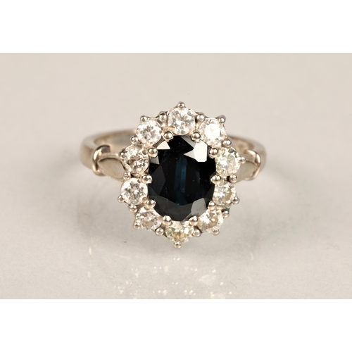 95 - Ladies 18ct white gold, diamond and sapphire ring, central sapphire surrounded by ten 0.1 carat diam... 