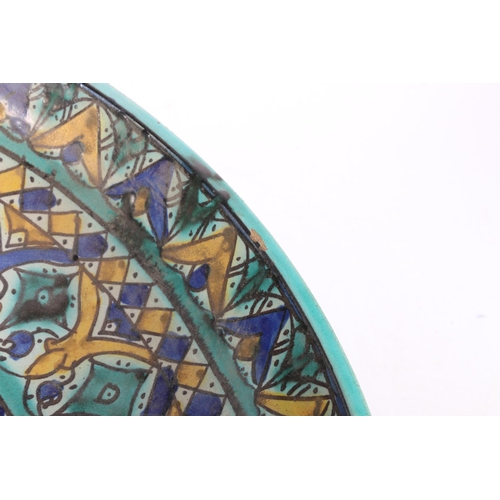 171 - Large Persian Iznik style pottery footed bowl with turquoise, blue and yellow geometric decoration, ... 