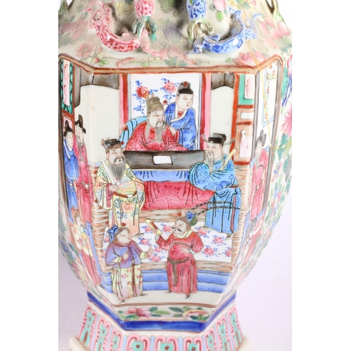 185 - Pair of Chinese Canton famille rose vases, with vignettes of figures and relief animal decoration, b... 