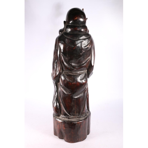 190 - Carved wooden figure of a Chinese immortal Pu-tai, 57cm high.  #485