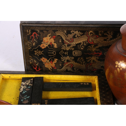 223 - Chinese wood carvings of pigs, 9cm wide, an Oriental gilded and japanned black lacquered box contain... 