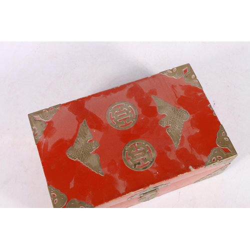 227 - Chinese red lacquer brass mounted box containing Mah-Jongg tiles, 24cm long.