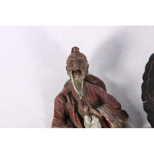 235 - Resin wall panel in the form of an elderly oriental gentleman holding a staff and lantern, 30cm high... 