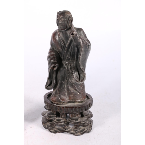 237 - Oriental bronzed pewter or lead figure of a gentleman in robe, on wooden stand, 23cm high and a cela... 