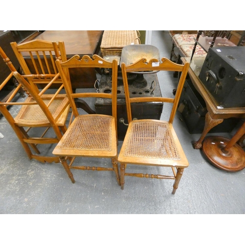 427 - Four various Edwardian cane seat dining chairs.