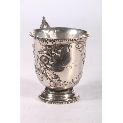 110 - Continental silver christening mug with embossed floral decoration, marks rubbed, 101g, 9cm high. #1... 