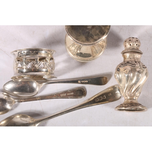 122 - Silver pepperette, a silver napkin ring, a silver vase, and three silver spoons, 117g gross. #201