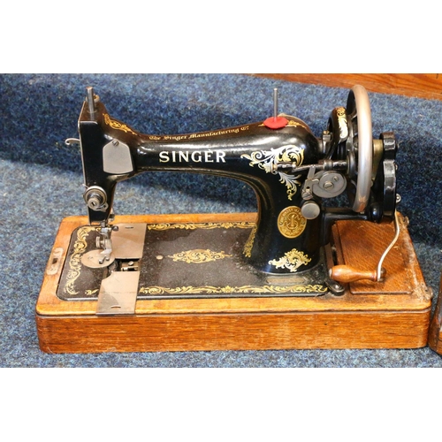 472 - Oak cased Singer sewing machine.