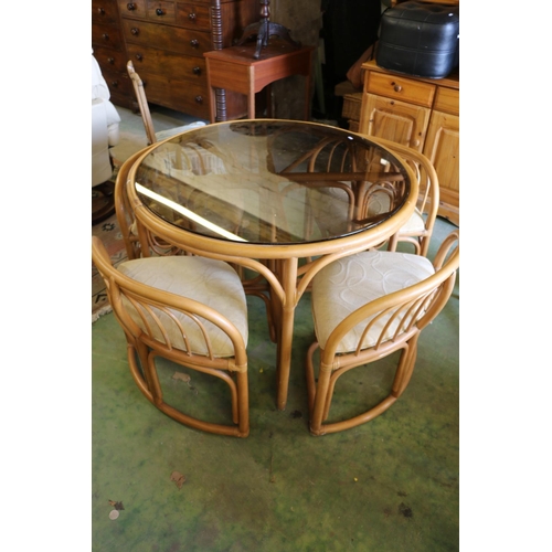 548 - Glass topped conservative table and four chairs