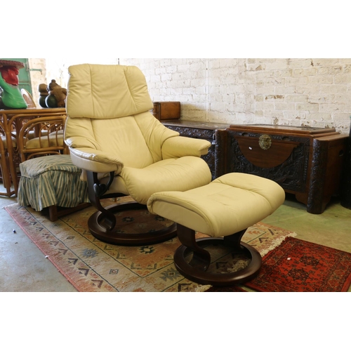 552 - Ekornes cream Lazy Boy with footstool.