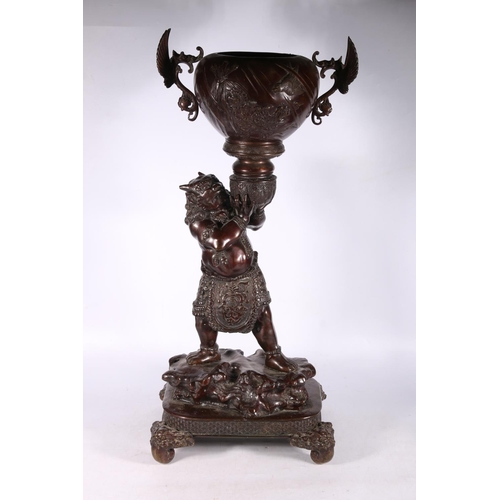 191 - Japanese bronze figure of a devil (Oni) holding a winged bowl, possibly a censer, 78cm high. #486