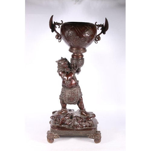 191 - Japanese bronze figure of a devil (Oni) holding a winged bowl, possibly a censer, 78cm high. #486