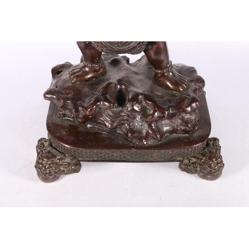 191 - Japanese bronze figure of a devil (Oni) holding a winged bowl, possibly a censer, 78cm high. #486