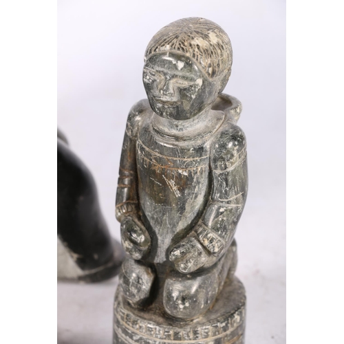 244 - Five Canadian Innuit soapstone or serpentine carvings comprising a hunter with tent, a kneeling figu... 