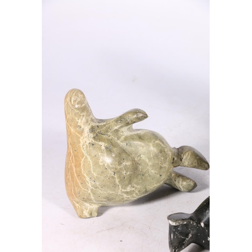 244 - Five Canadian Innuit soapstone or serpentine carvings comprising a hunter with tent, a kneeling figu... 