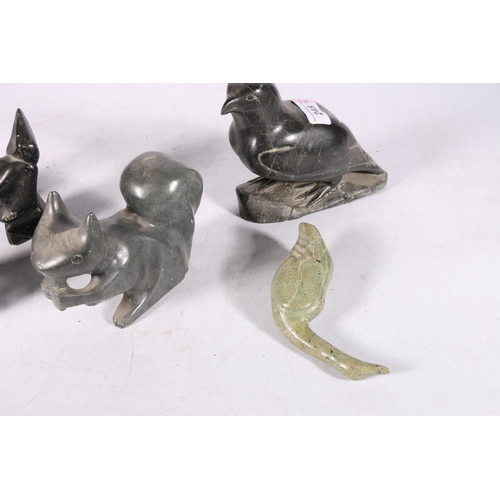 245 - Six Canadian or Inuit soapstone carvings to include a reclining seal, a squirrel, a falcon, etc.  (6... 