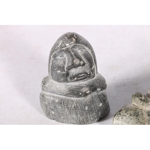 245A - Three Canadian or Inuit soapstone carvings, one of a man on sled, 12cm long, and two others.  (3)  #... 