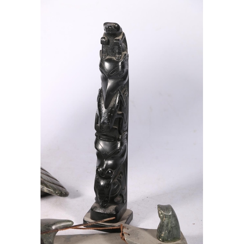 246 - Three Canadian or Innuit soapstone carvings to include a hunter in sledge with two huskies, signed t... 