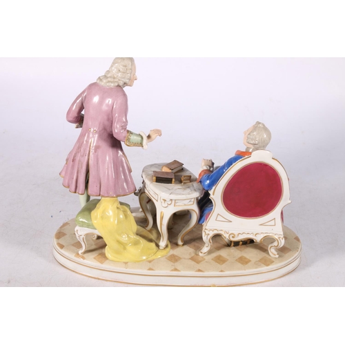 256 - French porcelain figure group of Frederick II and Voltaire modelled seated with a greyhound, 23cm hi... 