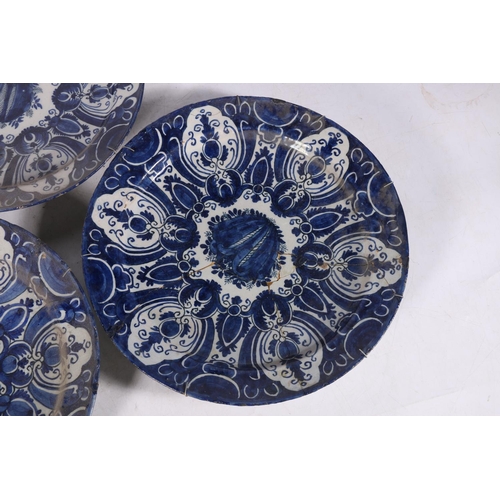 266 - Three 18th century Delft pottery plates, matching cobalt blue and white design, 31cm diameter.  (3) ... 