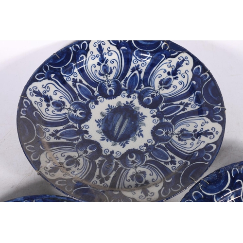 266 - Three 18th century Delft pottery plates, matching cobalt blue and white design, 31cm diameter.  (3) ... 