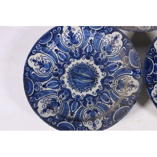 266 - Three 18th century Delft pottery plates, matching cobalt blue and white design, 31cm diameter.  (3) ... 