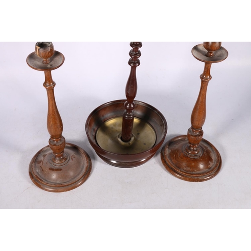 278 - Pair of turned oak candlesticks, 33cm long and a 19th century mahogany stand, 53cm high.  (3)  #313