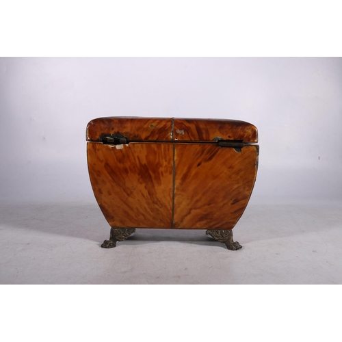 279 - 19th century tortoiseshell tea caddy of casket form, having twin division interior, raised on metal ... 