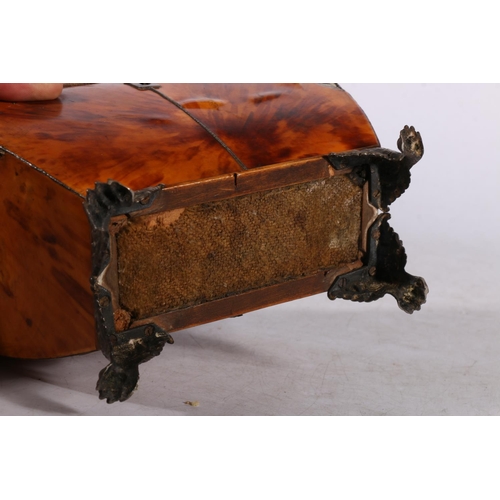 279 - 19th century tortoiseshell tea caddy of casket form, having twin division interior, raised on metal ... 