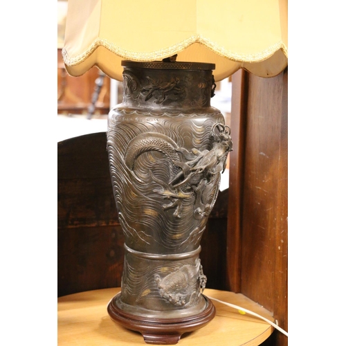 141 - Japanese bronze vase table lamp, relief dragon decoration, with yellow shade, 91cm high. #64