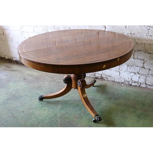 392 - Early 19th century rosewood tilt-top breakfast table, the circular snap top with brass inlay, raised... 